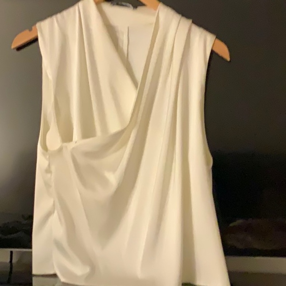 This Satin sleeveless white blouse is gently worn one time. Size large from Zara
